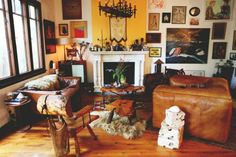 a living room filled with furniture next to a fire place