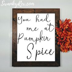 a sign that reads, you had me at pumpkin spice next to a dried flower