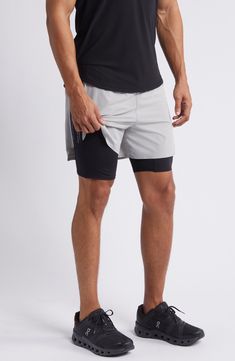 Train hard in layered performance shorts constructed with a lightweight overlay, convenient drop-in pockets and stretchy shorts underneath. 9" inseam; 15" leg opening; 12 1/2" front rise; 13 1/2" back rise (size medium) Elastic waist Side drop-in pockets Partially lined 84% nylon, 16% elastane Machine wash, tumble dry Imported Gray Compressive Moisture-wicking Athletic Shorts, Gray Breathable Running Shorts, Breathable Gray Running Shorts, Gray Breathable Shorts For Running, Gray Compression Running Shorts, Gray Compression Athletic Shorts For Running, Functional Gray Athletic Shorts For Running, Moisture-wicking Gray Nylon Bottoms, Moisture-wicking Gray Running Shorts