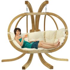 a woman laying in a hammock swing chair