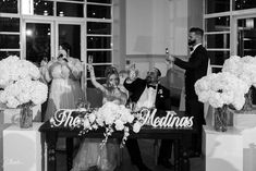 a bride and groom toasting at their wedding reception