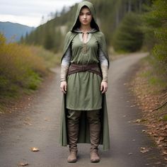 a woman dressed in costume standing on a path