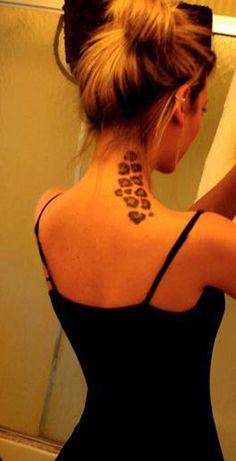 a woman with a tattoo on her back