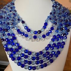 Gorgeous Vintage 1950's Bib Multi Strand Necklace From Coppola E Toppo .The Crystal Beads Are Multifaceted And In Beautiful Shades Of Blue Ranging From Light Sky Blue To Cobalt Blue To Navy Blue Mixed With Clear White Crystal Beads.The Necklace Is Approx.14" Long (The Shortest Strand) With A Beautiful 2.75" Extender .Fully Hallmarked. Unusual Design ,One Of Kind, Vibrant And Simply Gorgeous! 1950s Beaded Jewelry, Beaded Bib Necklace, Light Sky Blue, Clear White, Unusual Design, White Crystal, Multi Strand Necklace, Bib Necklace, Vintage Crystal