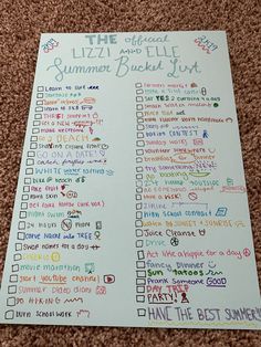 the official liz and bill summer bucket list is on the floor next to a phone