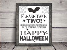 a sign that says please take two happy halloween