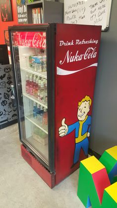 a vending machine sitting inside of a store