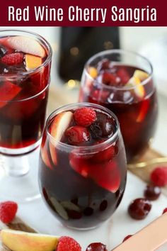 two glasses filled with red wine cherry sangria