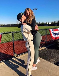 two people hugging each other with the caption 10 secret ways to catch a cheering partner