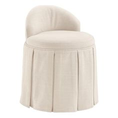 an upholstered chair with pleated fabric