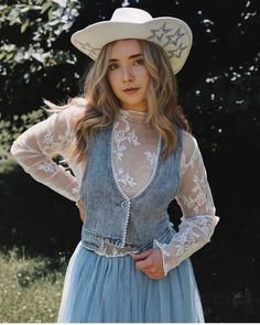 Wild Rose Bohemian Western Lace Top. Long sleeve layering blouse with mock neckline, sheer floral embroidery throughout, stretchy fit, and soft white vintage color.  Feminine and dainty addition to any sleeveless vest or cropped or plunge neckline tops for a dreamy feel and more coverage.  Perfect for lovers of western bohemian style. Make it your choice for a rodeo, bridal cowgirl look, girl's nights,music festivals, trips to Vegas and much more for a unique top that flatters and softens like n Spring Lace Patchwork Tops, Spring Lace Patchwork Top For Layering, Fitted Lace Top For Summer Layering, Fall Lace Top With Patchwork For Layering, Spring Lace Top With Lace Sleeves For Layering, Spring Blouse With Sheer Sleeves For Layering, Feminine Summer Lace Top With Sheer Sleeves, Fall Lace Blouse For Layering, Spring Lace Patchwork Blouse For Layering