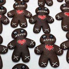 many decorated cookies are arranged in the shape of zombies