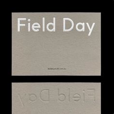 two business cards with the words field day printed on them, one in white and the other in black