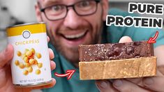 a man holding a can of protein bar next to a peanut butter and chocolate bar