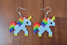 the earrings are made out of legos and have an image of a pony on it