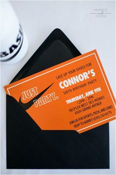 an orange and black party card with the words just party on it next to a cup