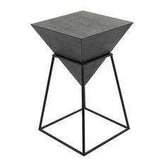 a black metal and wood side table on a white background