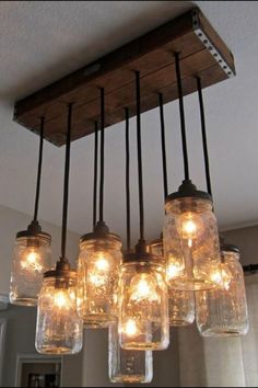 mason jar chandelier with lights hanging from the ceiling