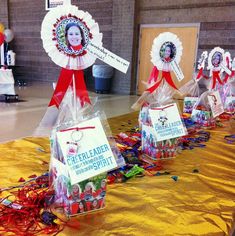 the table is set up with decorations and cards for people to put on them,