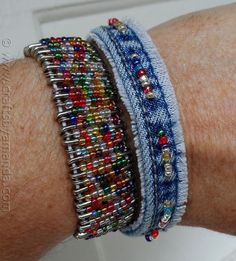 a person's arm with several bracelets on it