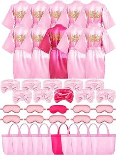 pink satin bridesmaid robes and accessories for her wedding day, including blindfolds