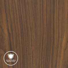 an image of wood grained surface with white circle logo on the bottom right corner