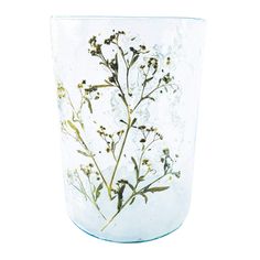 a glass vase with flowers painted on the outside and inside, sitting in front of a white background