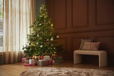 a living room with a christmas tree and presents