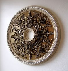 a decorative metal plate mounted on the wall