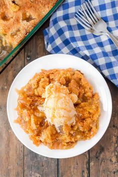 a white plate topped with food next to a casserole