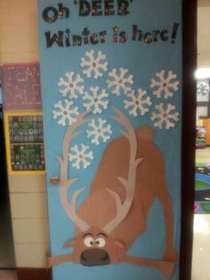 a bulletin board with an image of a reindeer and snowflakes on it that says, oh deer winter is here