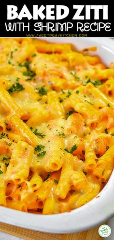 baked ziti with shrimp and cheese in a white casserole dish on a wooden table