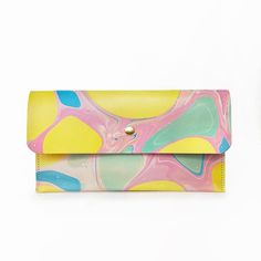 Marbled Leather - Colorful Hand marbled, vegetable tanned leather clutch with solid brass snap closure. Perfect for any time you're dressed up.All of our marbled items are completely unique, the item you will be receiving will not be the exact item pictured. If there are specific colors you would like to see in your marbling you can add them into the notes on the cart page. Features:• Heavy duty vegetable tanned leather• Hand marbled in a colorful paletteMeasures:• 12in wide, 7in tall Multicolor Leather Rectangular Clutch, Multicolor Rectangular Leather Clutch, Multicolor Everyday Clutch Wallet, Multicolor Clutch Wallet For Everyday Use, Everyday Multicolor Clutch Wallet, Button Studs, Colorful Bags, Marbling, Colored Leather