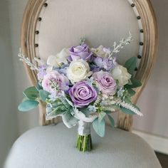 a bouquet of flowers sitting on top of a chair