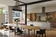 a large wooden table sitting in the middle of a living room