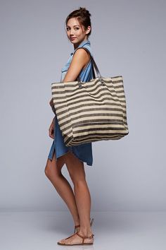 Natural Jute Striped Shoulder Bag Wide shaped striped jute shoulder bag with faux leather straps. - 60% Jute, 40% Polyester - Bottom = 20inches x 8inches, Height = 15 inches, Top Opening = 23 inches Backpacks Designer, Jute Handbags, Jute Totes, Beach Tote Bag, Love Stitch, Boho Bags, Leather Gifts, Big Bags, Tote Bag Pattern