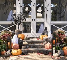 halloween decorations on the front steps of a house