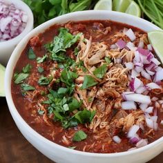 a white bowl filled with taco soup and garnished with cilantro