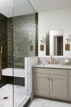 a bathroom with two sinks and a walk in shower