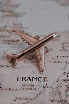 a map with a plane on it and the word france written in black is shown