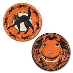 two orange plates with black cats and bats on them