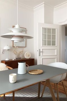 a dining room with a table and chairs