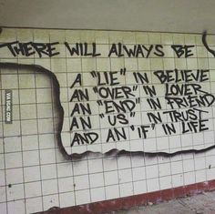 graffiti on the side of a wall in an abandoned building, with words written on it