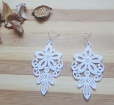 White, lace earrings made by lace type computer embroidery. Lace Earrings, Computer Embroidery, Earrings White, Black Earrings, White Lace, Jewelry Earrings Dangle, Poland, White Black, Dangle Drop Earrings