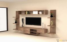 a living room with shelves and a flat screen tv on it's wall unit