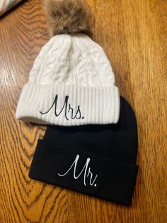 Mr. and Mrs. Embroidered Beanies Couples Knit Hats Wedding Gift Honeymoon Newlywed Anniversary Gift Ski Snowboard Warm Winter Hats Matching The skull caps are 100% acrylic and have a 3 inch folding cuff, these do NOT come with pom pom Faux Fur Pom Pom Toque * Acrylic * Cuff Toque (Faux Fur Pom Pom 12cm * Jacquard cable knit High Quality Embroidered Beanies: Embroidered in London, ON. Unisex: Perfect For Both Men and Women. Lightweight. 100% Acrylic. Cozy Fit: Soft and Warm Material. One Size. RE Black Wedding Hat For Winter, Black Winter Wedding Hat, Adjustable Mini Hats For Winter Wedding, Embroidered Wedding Hat, Leather Wedding Gifts, Christmas Monogram Shirt, Embroidered Beanies, Snowman Shirt, Mr Und Mrs