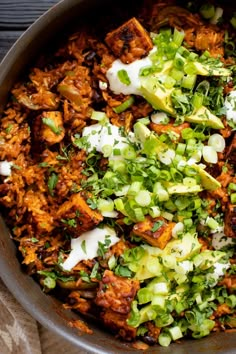 a large pot filled with lots of food on top of a table