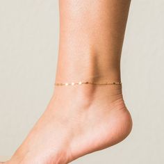 Our Lace Chain Anklet is the perfect accessory you didn't know you needed. It has a beautiful, subtle sparkle at every angle, making it perfect for a day at the beach or a summer night out with the girls. Pair it with white sneakers or cute sandals, and you're set! DETAILS Anklet length: 8" with 2" extender 14k gold filled -or- sterling silver chain, spring clasp, and findings Matching pieces: Lace Chain Necklace, Dainty Chain Bracelet Summer Beach Anklet With Adjustable Chain, Trendy Summer Anklets As A Gift, Minimalist Summer Anklets As A Gift, Minimalist Summer Anklets For Gifts, Minimalist Summer Anklets As Gift, Adjustable Chain Anklets For Summer, Summer Anklets With Adjustable Chain, Dainty Anklets For Beach In Summer, Dainty Anklets For Beach And Summer