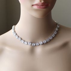 "Beautiful stunning oval cubic zirconia  statement necklace, bracelet and stud earrings set that is great for the bride and for other occasions.  The necklace is made of a strand of 10 mm oval CZs with back drop CZ pendant, gorgeous for bridal wear, the oval CZs measure 10 x 12mm, length is 16 inches adjustable to 20 inches, I can custom make the lengths you prefer, please leave a note if you prefer a different length. Matching bracelet measure 6.5-7.5 inches with adjustable link extenders. Stud earrings measure 12 x 14mm.  This set is made of AAA top quality oval shaped cubic zirconia in high quality white gold (silver colored), rose gold and yellow gold plated settings. They have long lasting colors and are hypoallergenic to wear (nickel and lead free).  Please leave a note in the \"note Drop Necklace Silver, Mothers Gifts, Silver Drop Necklace, Silver Wedding Jewelry, Bridal Jewelry Set, Gold Bridal Earrings, Back Drop, Cubic Zirconia Jewelry, Cz Necklace