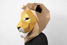 a paper model of a lion's head in low polygonic style, on a white background